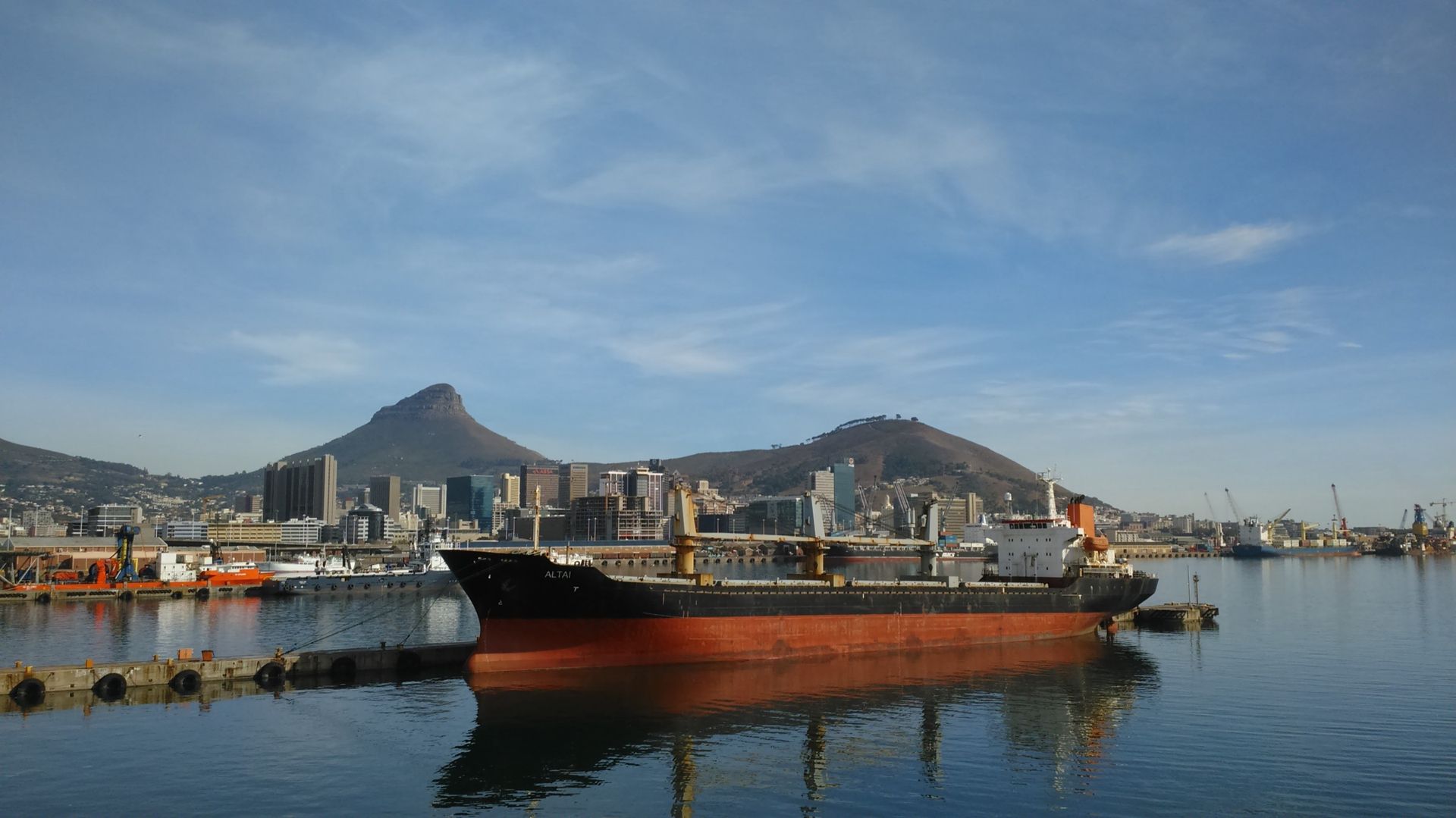 Container port with cranes and a cargo ship